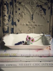 hardback books with tray and flowers