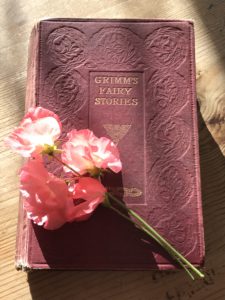 Vintage Grimm's fairy tale book with sweet peas