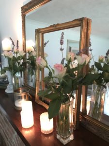 Mantle piece with candles and mirrors