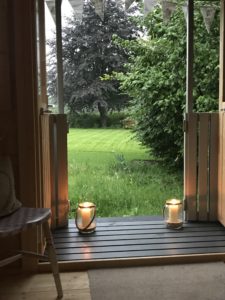 view of the back garden from Shepherds Hut with candles