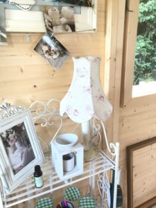 Pretty lamp on iron shelves in Shepherds Hut