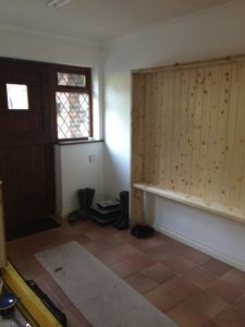 small room with tongue and groove cladding, tools and dust sheets