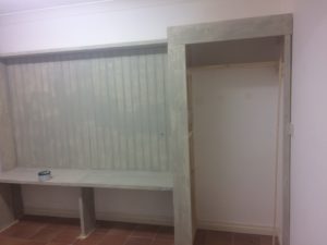 painting the seat and cupboard in the utility room