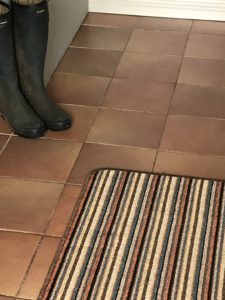 floor, wellies and runner in utility room