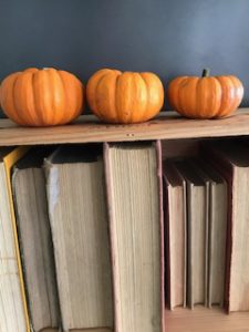 autumn pumpkins old books and vintage wine crate