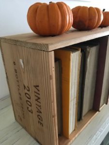 autumn pumpkins old books and vintage wine crate