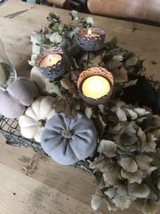 linen pumpkins hydrangea and tea lights create halloween decoration ideas