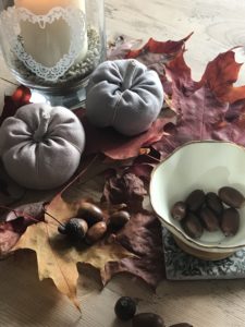 autumn decor display of candles pumpkins and foliage for halloween decoration ideas