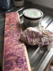 waxing a DIY decoupage sign