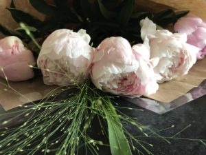 flower design using real and faux peonies and flowers