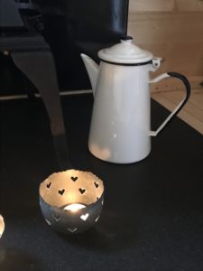 enamel coffee pot and tea light on granite in shepherds hut