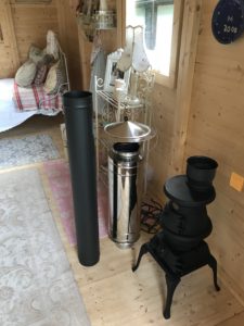 flue kit and stove in Shepherds Hut before installation 