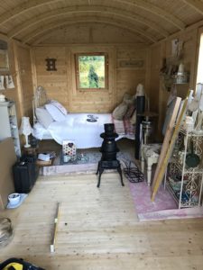 untidy interior of Shepherds Hut during stove installation