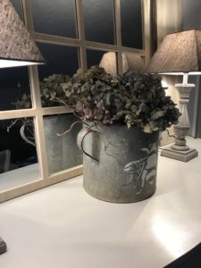 zinc bucket with hydrangea lamps and mirror during faffing session