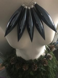 christmas baubles create necklace on mannequin for Christmas decor