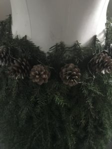 Fir tree branches create mannequin skirt for christmas decor