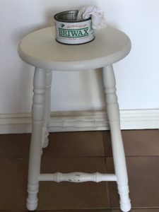 painted bar stools being waxed