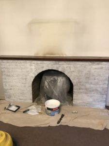 first coat white emulsion for fireplace makeover