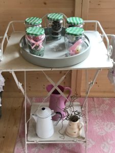 painted tray Bonne Mamman filled jars on vintage washstand with assorted jugs