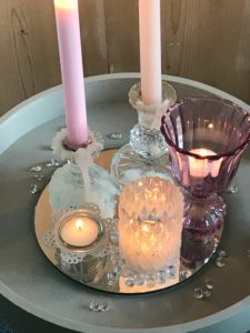 painted tray with lit pink candles and pretty tealights