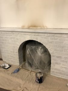 white painted fireplace plastic cover and tools for fireplace makeover