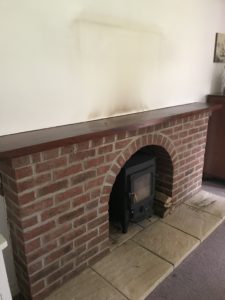 brick fireplace before fireplace makeover