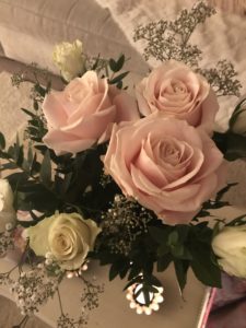 beautiful pink and cream bouquet with candle photographed from above