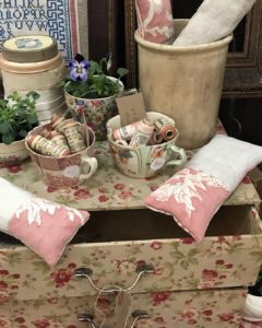 vintage cups threads pots and fabric boxes and pillows at spring fair