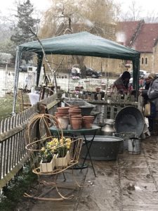 vintage garden finds under gazeebo at snowy spring fair