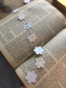 card flower paper garland on vintage book