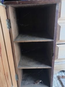 shelves inside old wooden pot cupboard before makeover