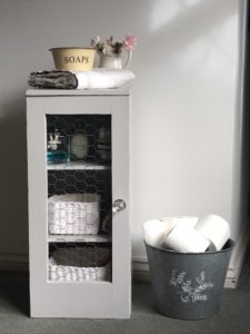 grey painted bathroom pot cupboard upcylce with bathroom paraphenalia 