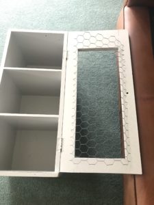 attaching chicken wire to inside door of painted pot cupboard