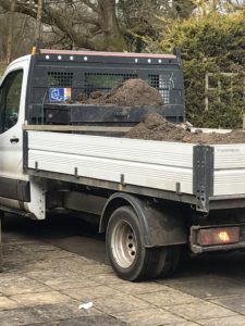 pick up truck with top soil for vegetable garden