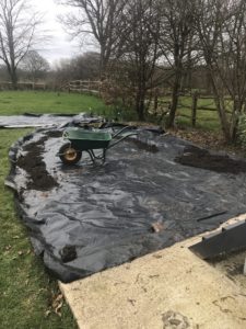 laying weed suppresant before topsoil in wildflower garden