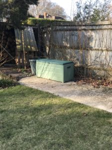 concrete base and green garden box where vegetable garden will be