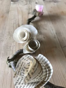 paper roses on twisted hazel branch