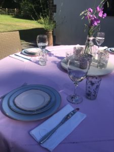 pink tablecloth, summer table set up for outdoor eating and patio dining