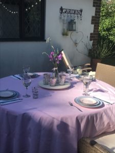 alfresco dining with summer table set up and pink tablecloth