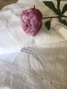 white cotton tablecloth, peony arrangements