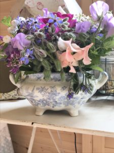 fresh cut flowers create simple flower arrangement in vintage blut tureen