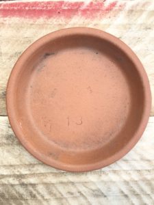 terracotta dish awaiting flower stencils - pot decoration