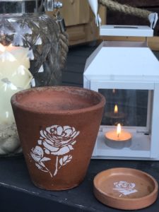 terracotta pots and dishes with flower stencils - pot decoration