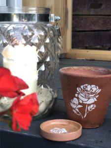 terracotta pots and dishes with flower stencils - pot decoration