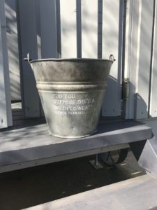 vintage pail with wildflower quote