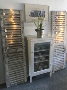 rustic shutters with star garland and lights create vintage home decor - shabby chic wall decor