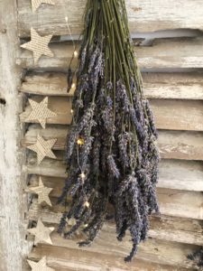 dried lavender bunch, star garland and lights on rustic shutters create vintage home decor and shabby chic wall decor