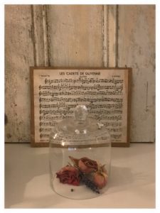 vintage home decor - rustic shutters, glass dome, dried roses and music sheet