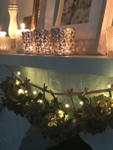 Preserving flowers - hydrangea heads and fairy lights on garland for flower art with candles