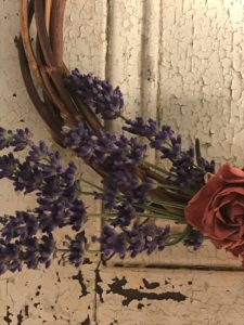 preserving flowers - rose and lavender wreaths detail against shutters